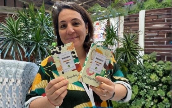 Artisan chocolate maker presenting chocolates