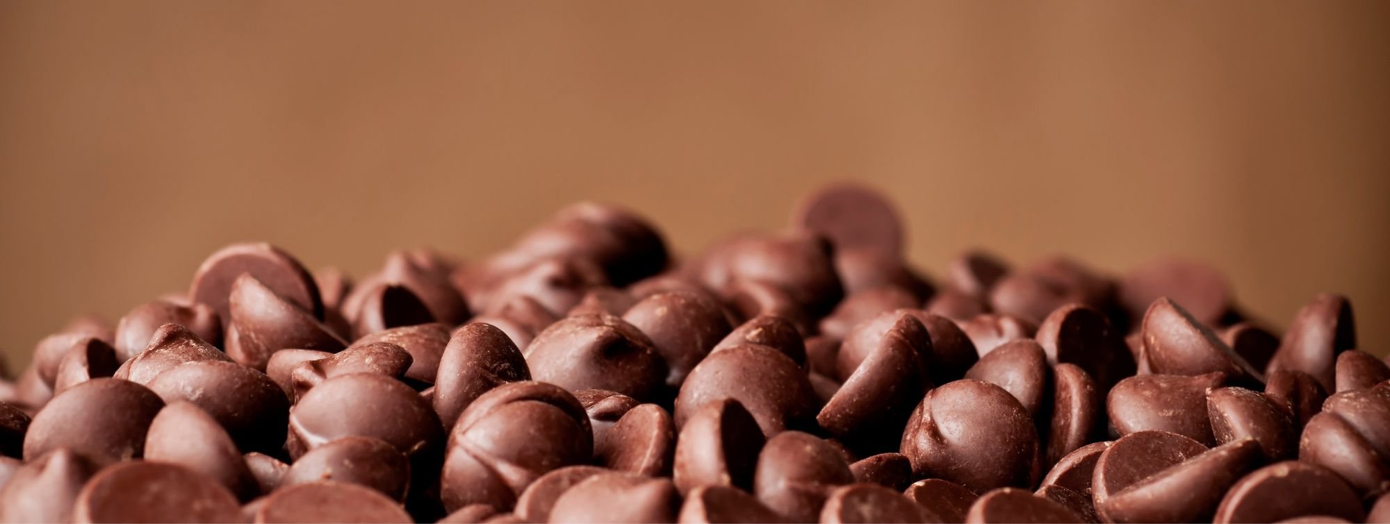 Chocolate nuggets on a brown background