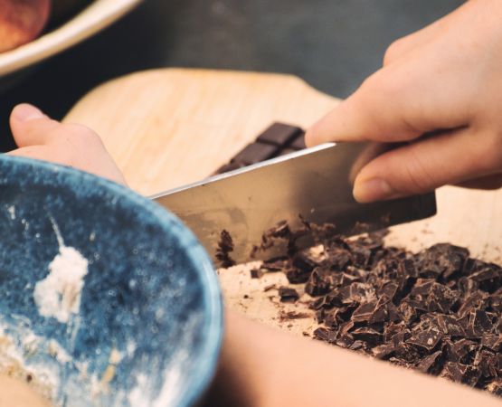 Someone crushing chocolate.