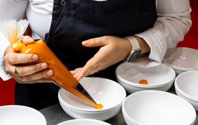 Plating a dish in progress.