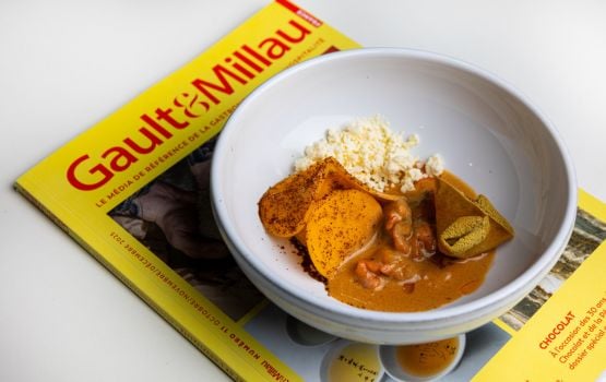 Gault & Millau magazine with a plated dish.