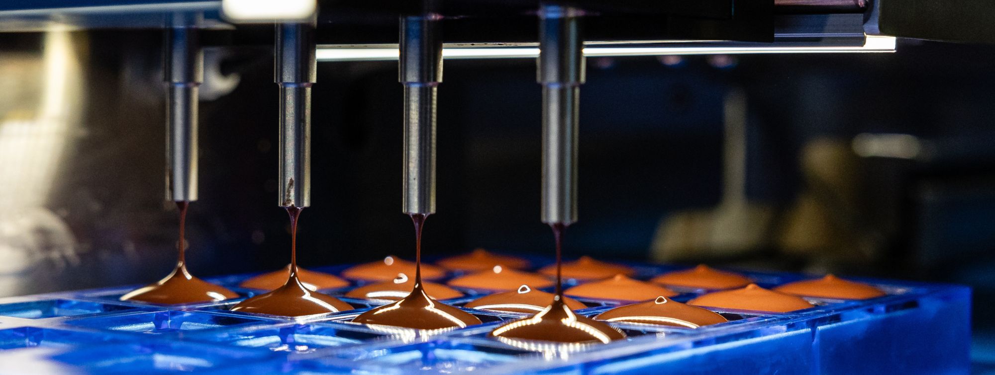 Machine in operation for making chocolate.